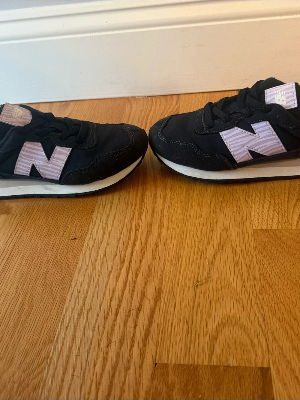 New Balance Kids Black Sneakers with Light Purple 'N' Detail